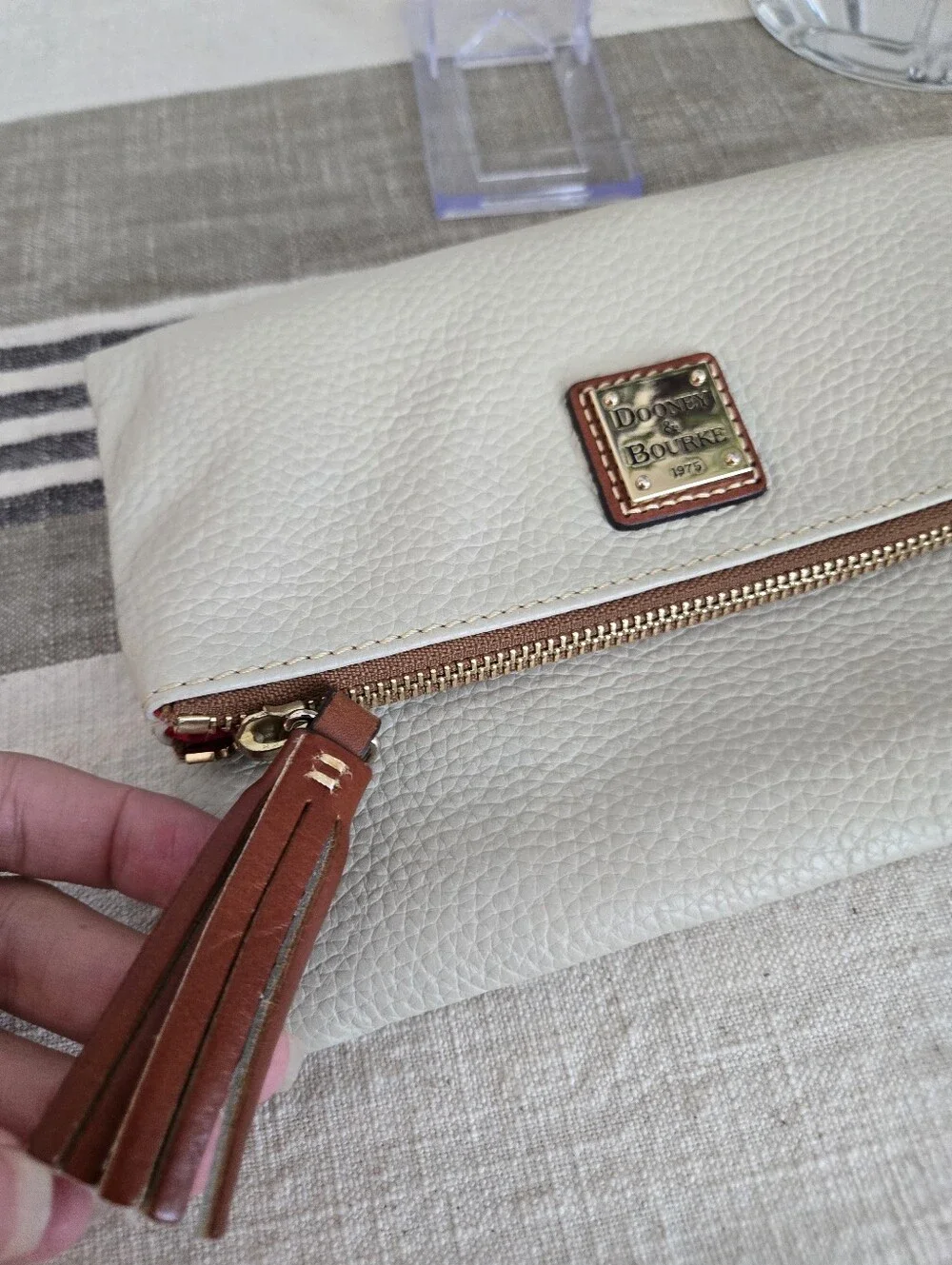 Dooney & Bourke Ivory Fold-Over Pebble Leather Clutch